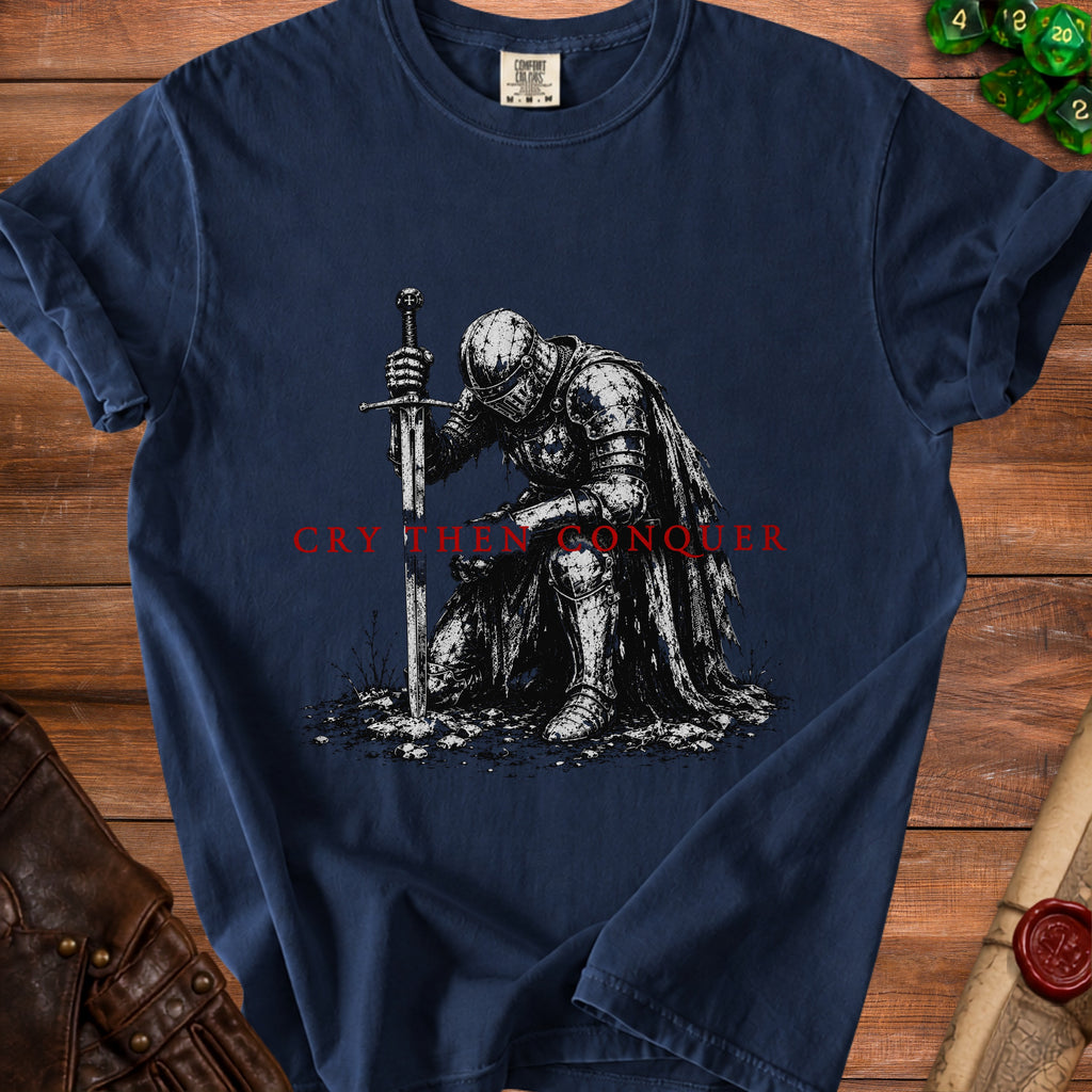 Navy t-shirt with knight art and "Cry Then Conquer" text.