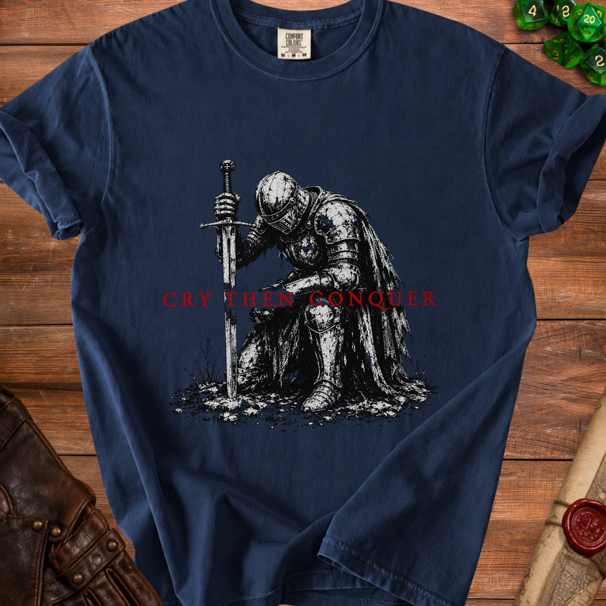 Navy t-shirt with knight art and "Cry Then Conquer" text.