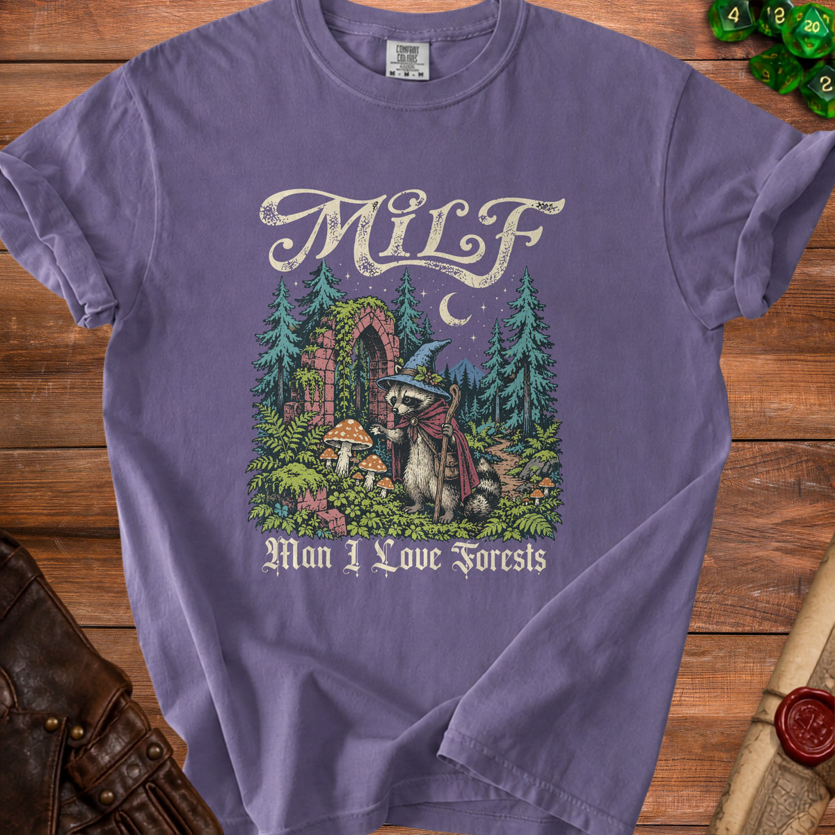 Purple t-shirt with a raccoon in a wizard hat and "MILF Man I Love Forests" text.