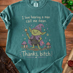 Teal t-shirt with green goblin wizard art and text "I love hearing a man call me mean. Thanks, bitch."