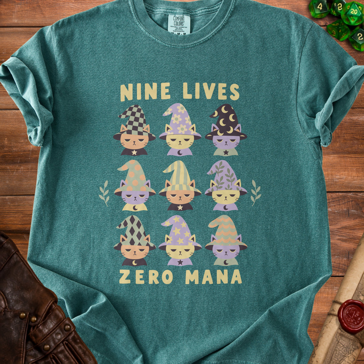T-shirt with nine wizard cats and "Nine Lives Zero Mana" text.