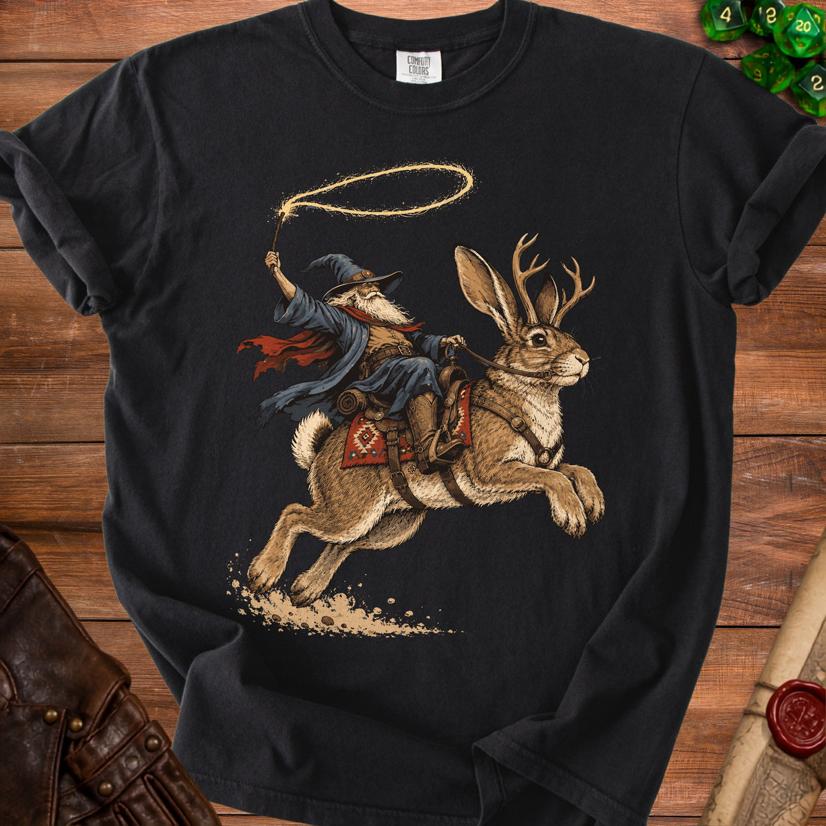 Wizard riding a rabbit with antlers, holding a lasso on a black t-shirt.
