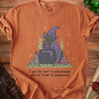 Orange t-shirt with a witch cat stirring a cauldron and text "I put the 'pro' in procrastinate and the 'crash' in productivity".