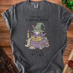 Dark gray t-shirt with graphic: "You call it a criminal record, I call it my lore."