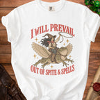 White t-shirt with graphic of witch riding winged frog, "I Will Prevail Out of Spite & Spells".