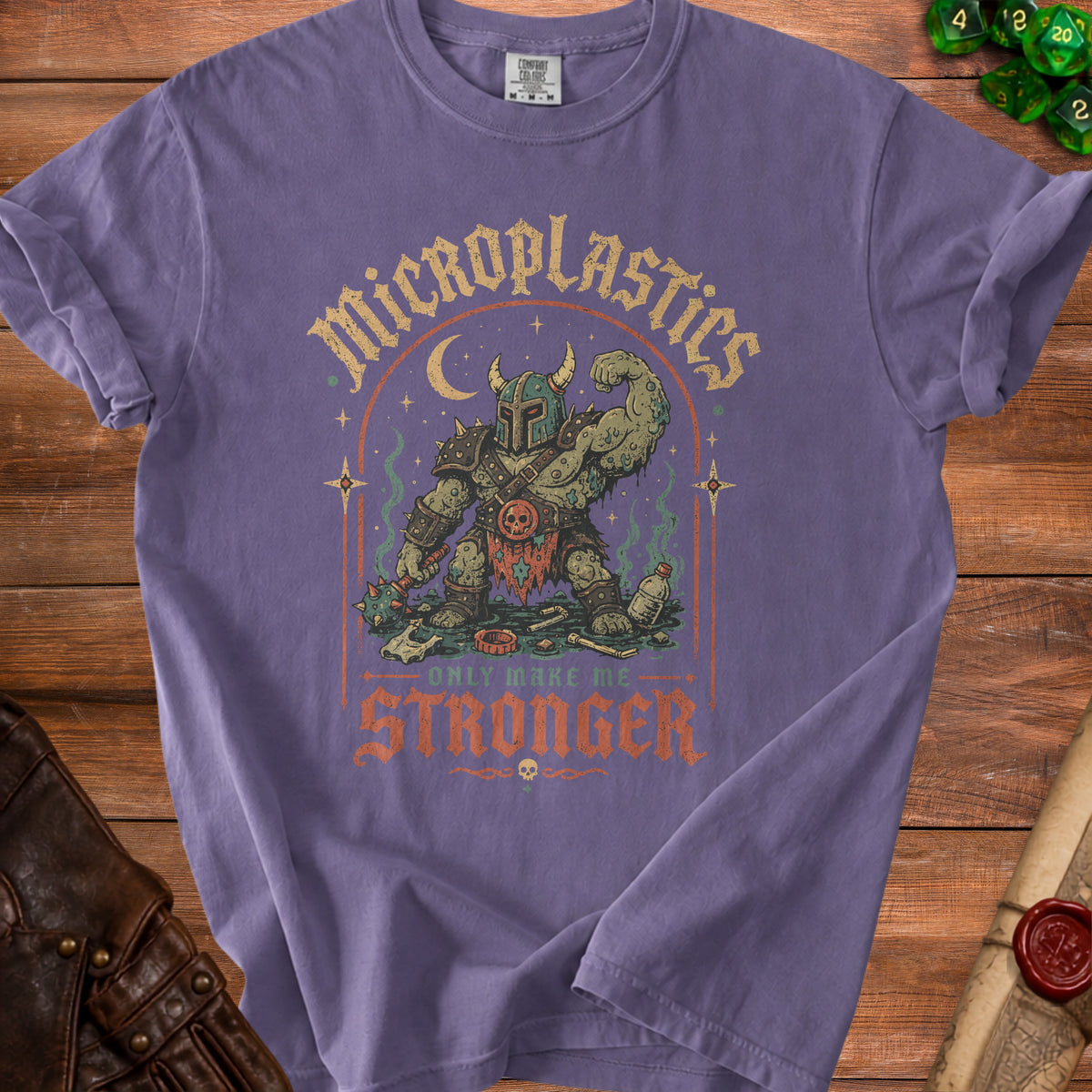 T-shirt graphic of a muscular monster with a skull on its belt, holding a mace.