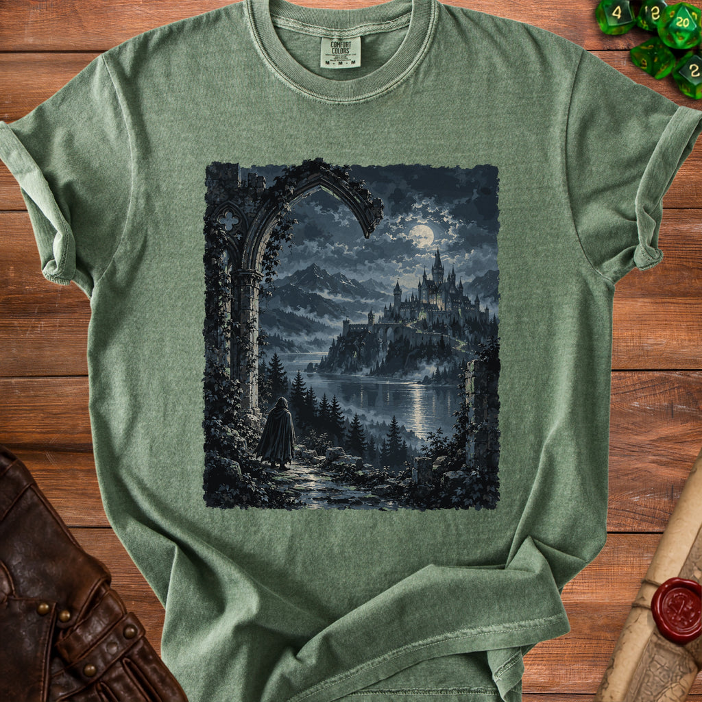 Green t-shirt with a graphic of a robed figure approaching a moonlit castle.
