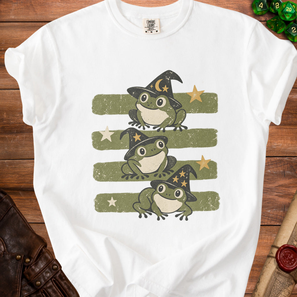 Three wizard frogs with witch hats on green stripes with stars.