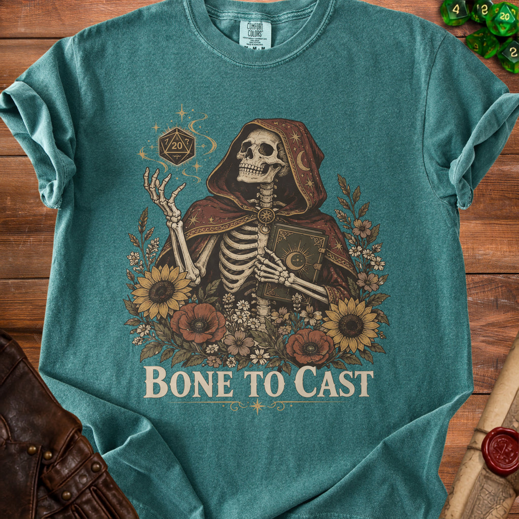 Skeleton in cloak holds book and d20 dice, text reads "BONE TO CAST".