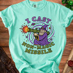 Light teal t-shirt with a wizard firing a missile, reading "I Cast Non-Magic Missile."