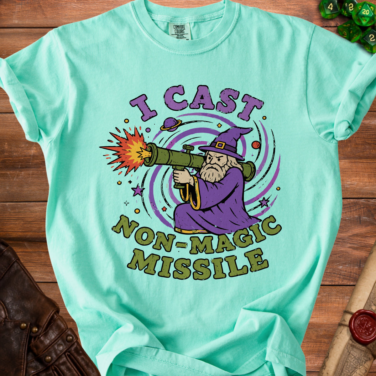 Light teal t-shirt with a wizard firing a missile, reading "I Cast Non-Magic Missile."