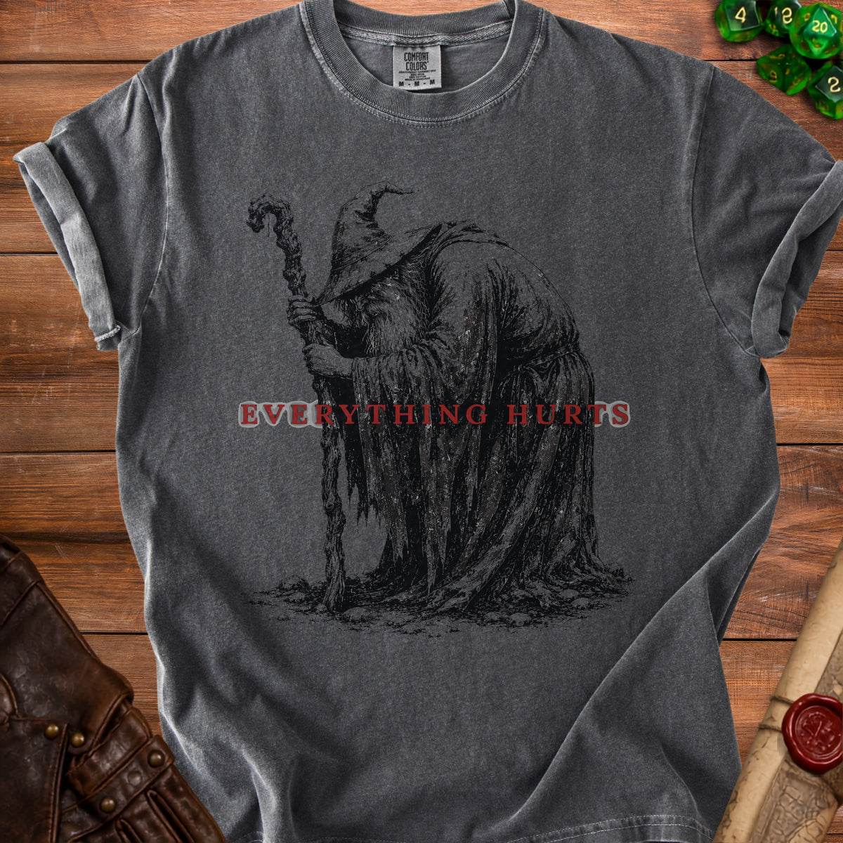 Dark t-shirt with a distressed wizard graphic and text "EVERYTHING HURTS".
