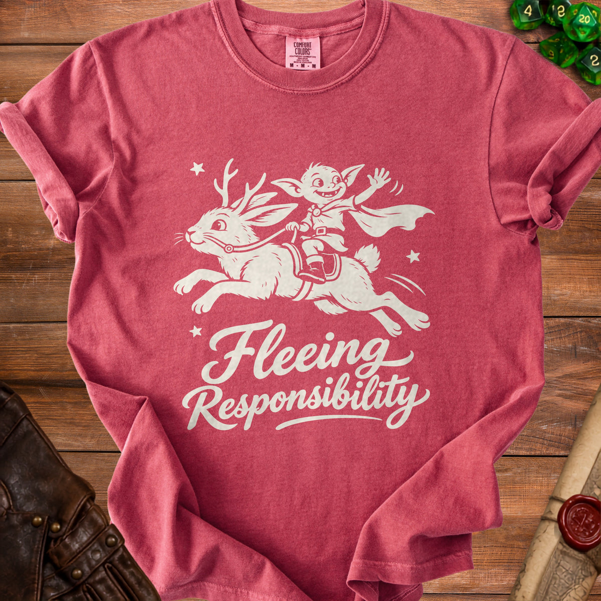 T-shirt with white graphic of a creature riding a horned rabbit with text "Fleeing Responsibility".