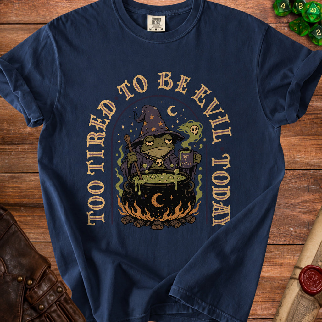 Navy t-shirt with a frog witch, cauldron, and "Too Tired to Be Evil Today" text.