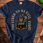 Navy t-shirt with a frog witch, cauldron, and "Too Tired to Be Evil Today" text.