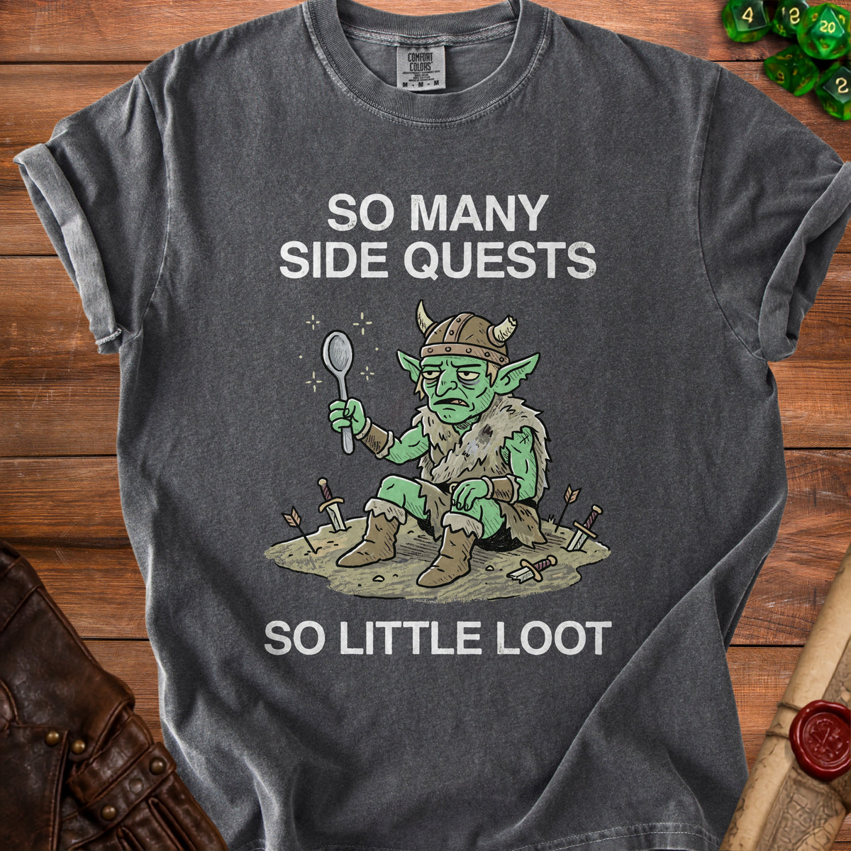 Dark grey t-shirt with illustration of a tired goblin holding a spoon and text "So Many Side Quests So Little Loot".