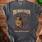 Dark t-shirt with "The Bean Coven" and "Gather for the Daily Grind" text.