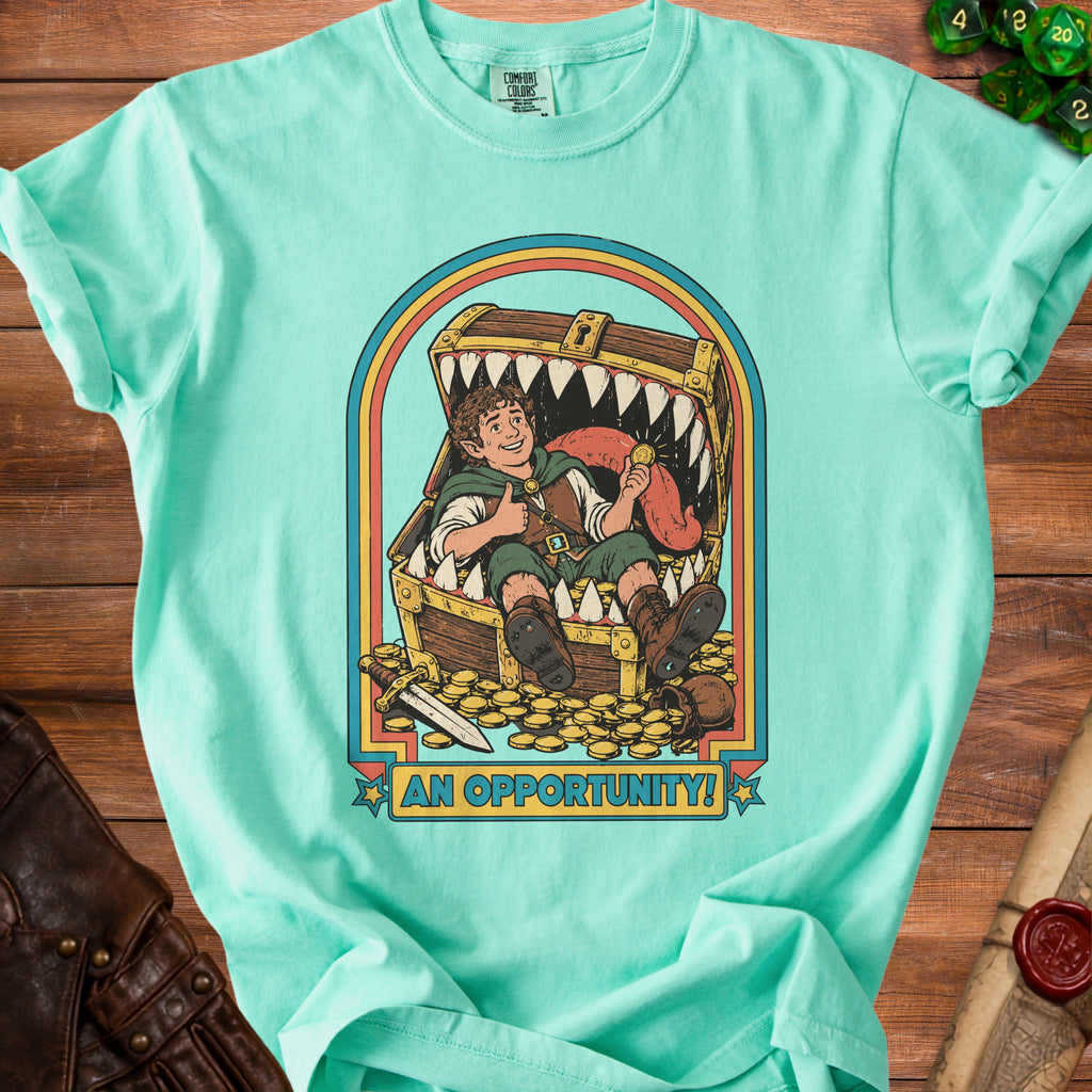 Mermaid green t-shirt with illustration of elf in treasure chest with text "AN OPPORTUNITY!".