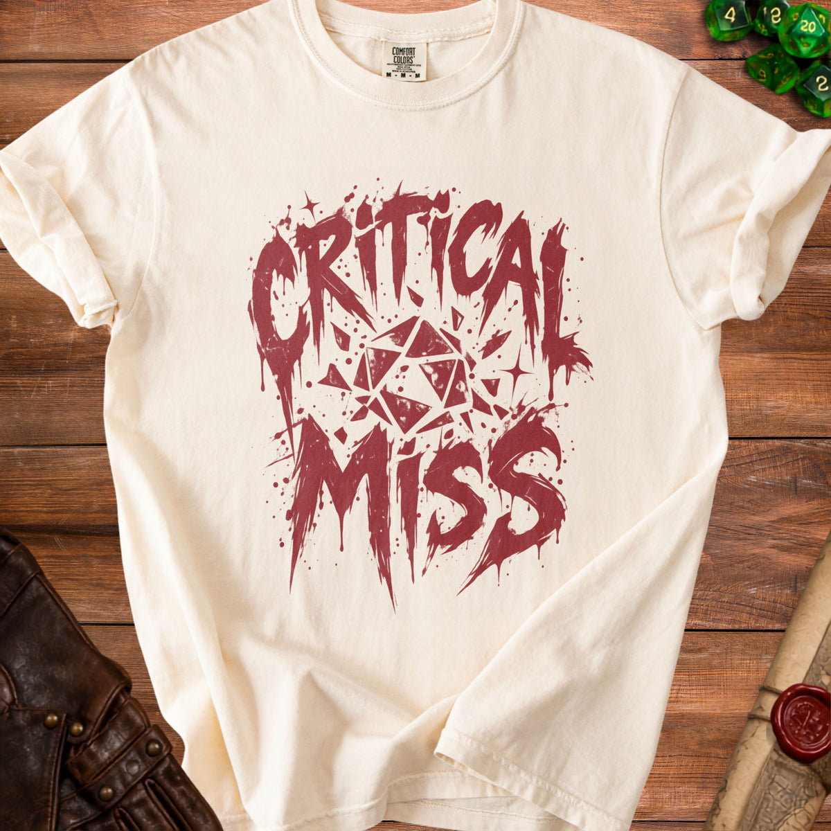 Cream t-shirt with distressed "Critical Miss" text and dice graphic.