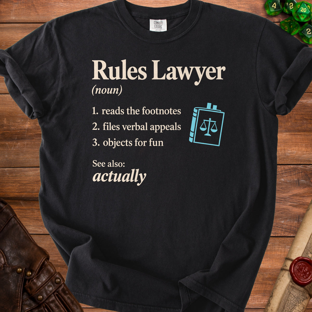 Black t-shirt with "Rules Lawyer" definition and scales of justice icon.
