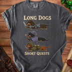 Dark grey t-shirt with cartoon dachshunds in knight, wizard, and archer costumes. "LONG DOGS SHORT QUESTS" text.
