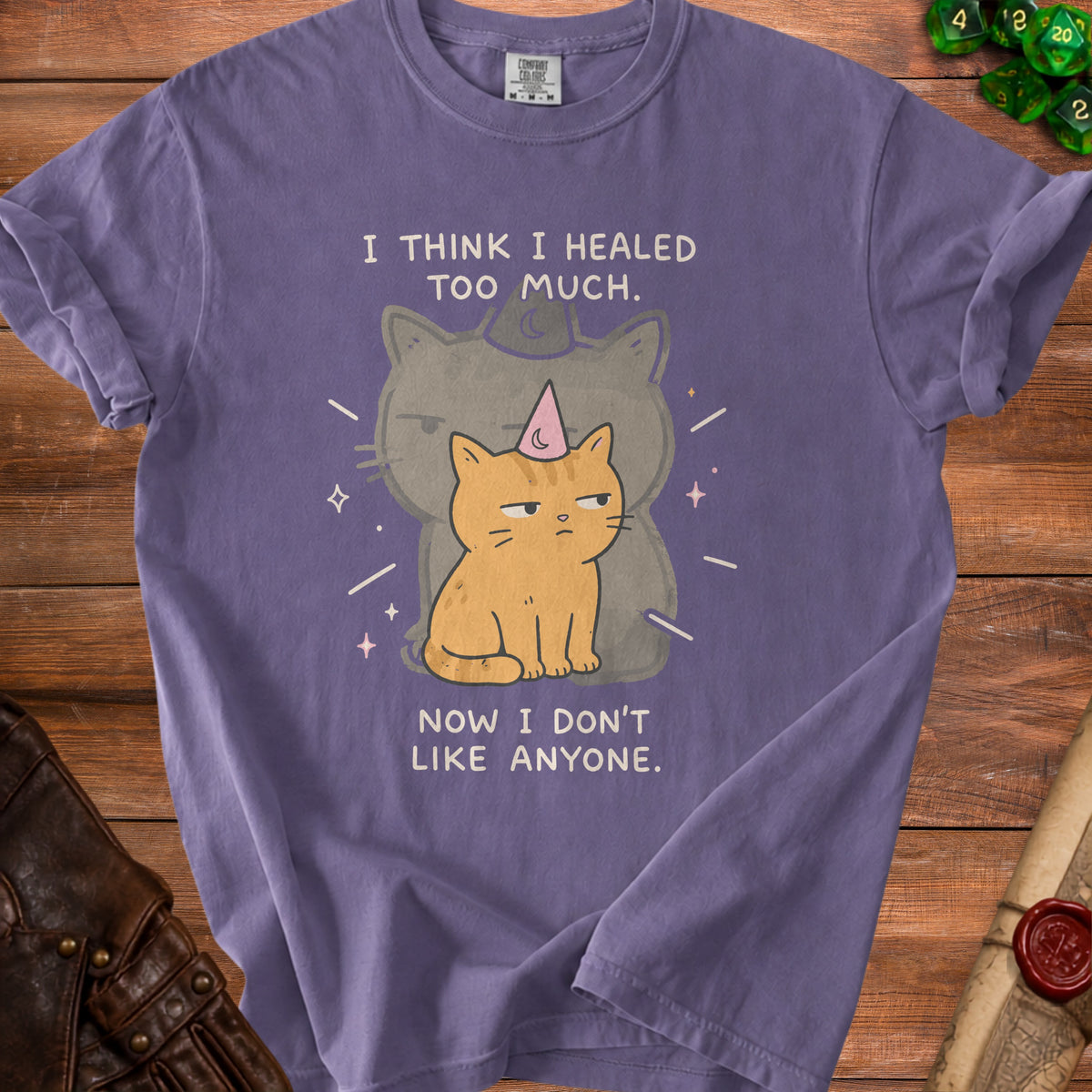 Purple t-shirt with illustration of a grumpy cat and text "I THINK I HEALED TOO MUCH. NOW I DON'T LIKE ANYONE."