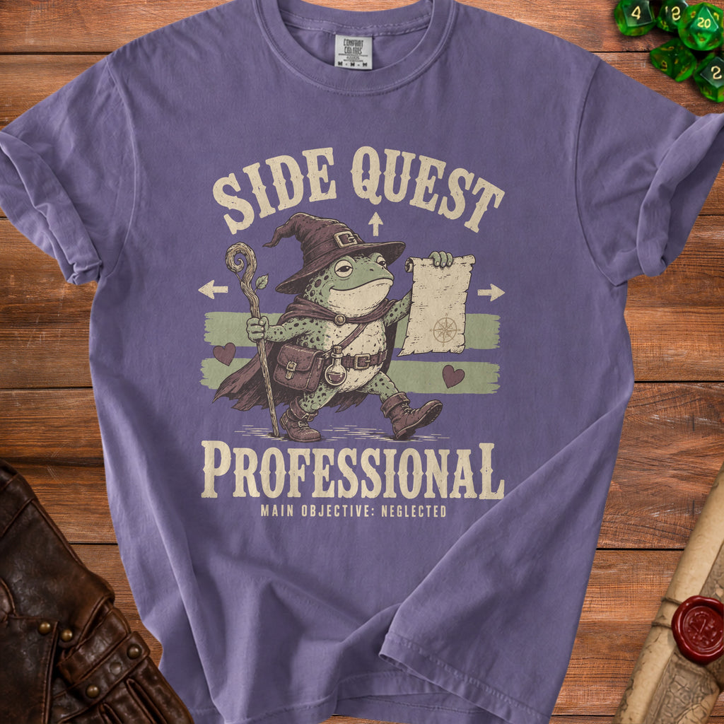 Purple t-shirt with wizard frog graphic that reads "Side Quest Professional Main Objective: Neglected".