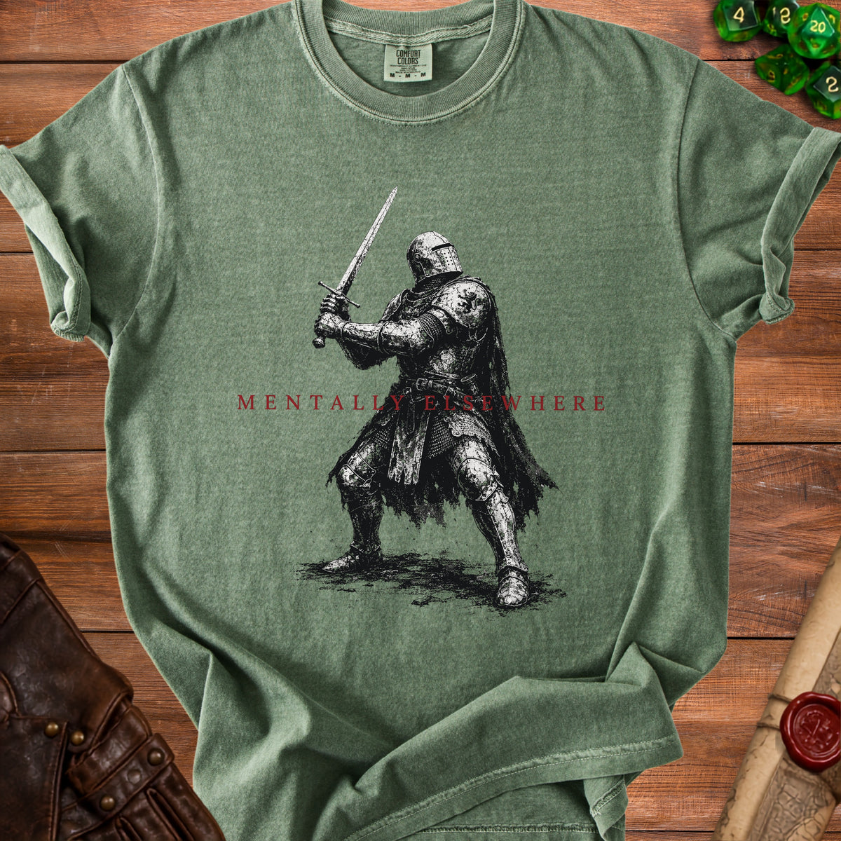 Green t-shirt with a knight holding a sword and "MENTALLY ELSEWHERE" text.