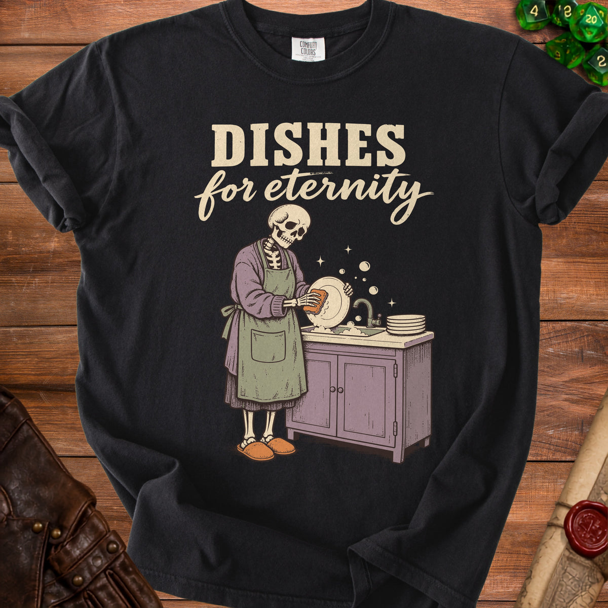 Skeleton washing dishes under text "Dishes for eternity" on black t-shirt.