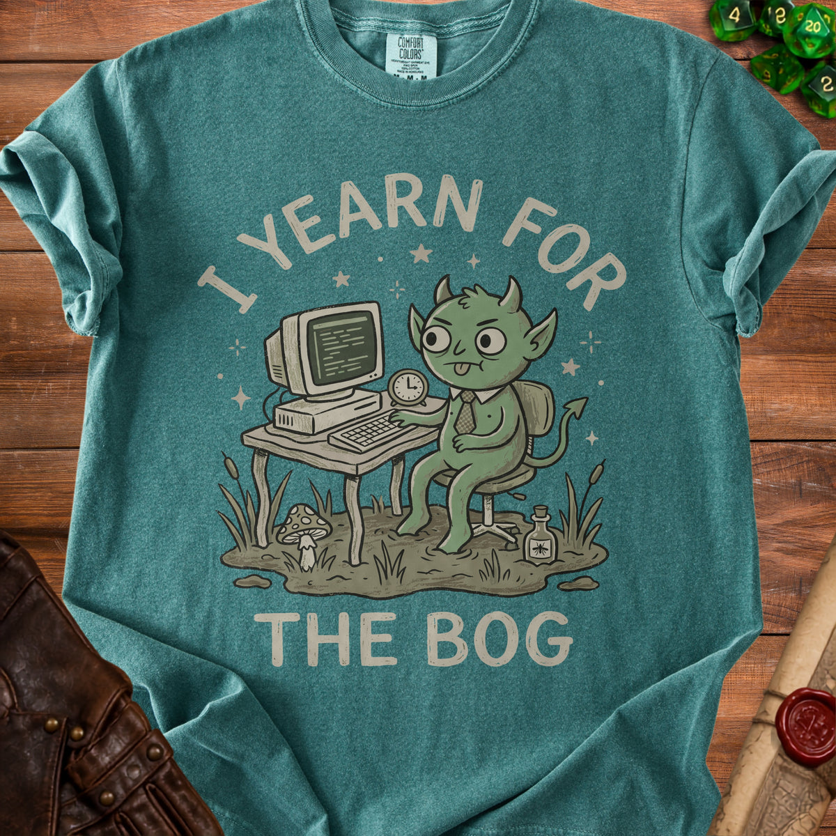 Green creature with horns at a computer on a desk with text I YEARN FOR THE BOG.