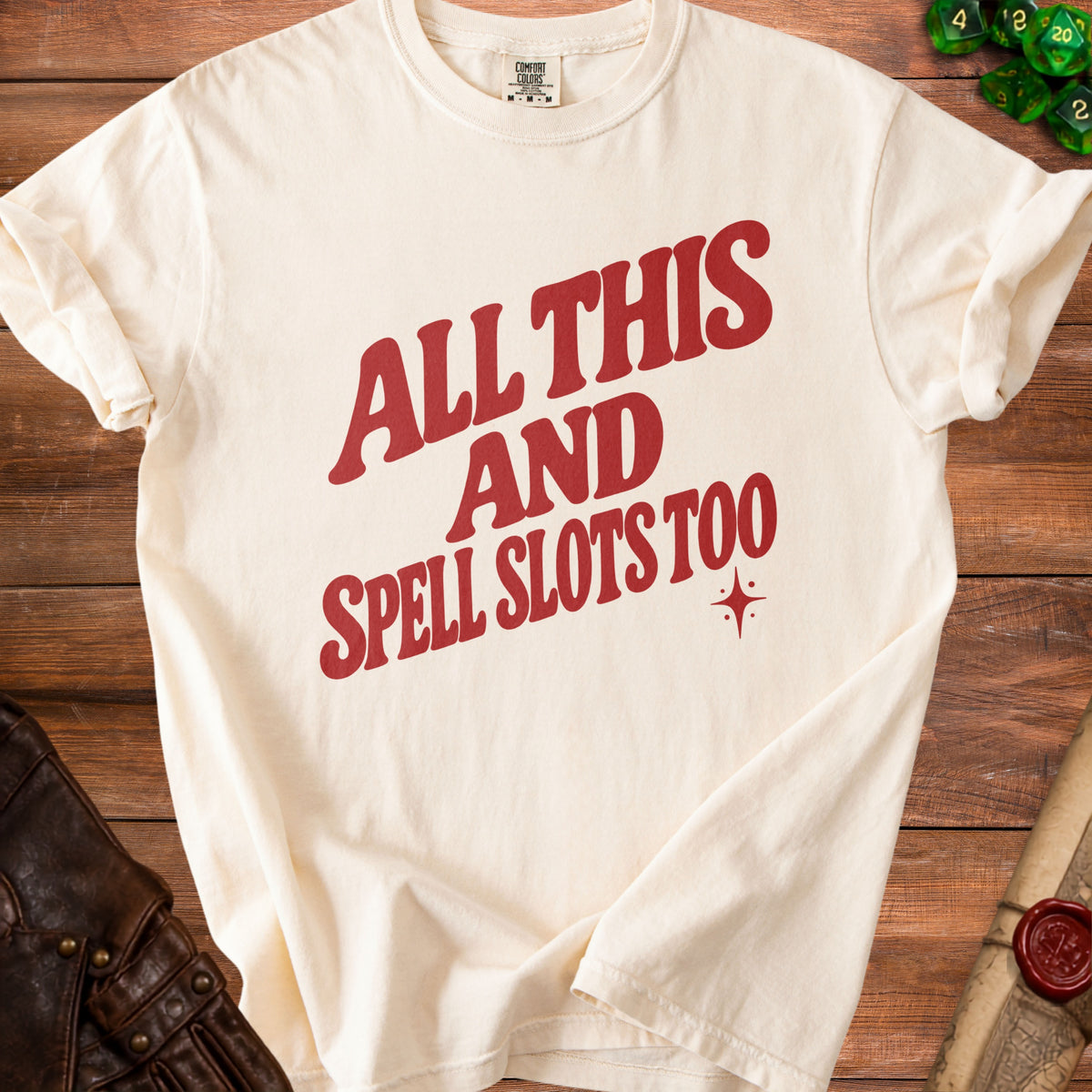 Cream t-shirt with red text reading "All This And Spell Slots Too."