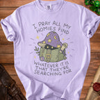 Purple t-shirt with "I pray all my homies find whatever it is that they're searching for" text.