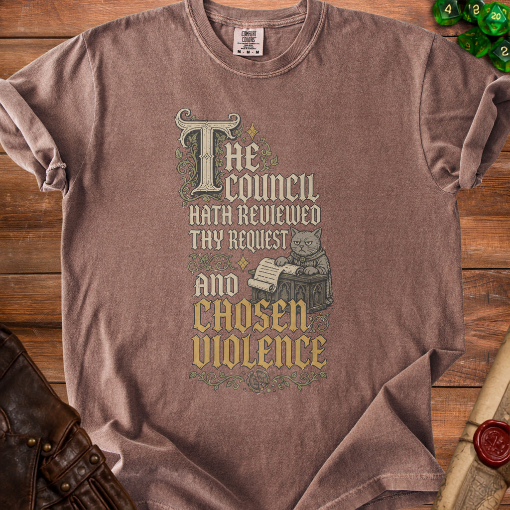 Brown t-shirt with vintage-style text and illustration of a cat reviewing a scroll.