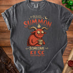 Dark grey t-shirt with graphic text "Please Summon Someone Else" and a cartoon demon.