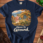 Goblin watering a hobbit hole in autumn scene with text "Gone to Ground".