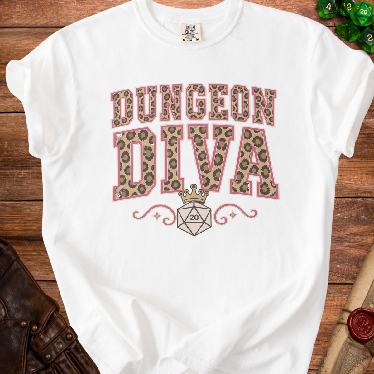 White t-shirt with "Dungeon Diva" text, leopard print, crown, and dice.