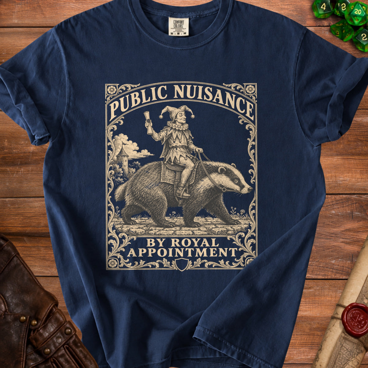 T-shirt with "PUBLIC NUISANCE BY ROYAL APPOINTMENT" text and jester riding badger graphic.