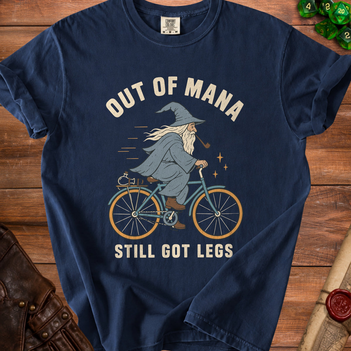 Wizard on bicycle graphic with text "OUT OF MANA STILL GOT LEGS".