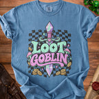 Blue t-shirt with "Loot Goblin" text, sword, mushrooms, and coins graphic.