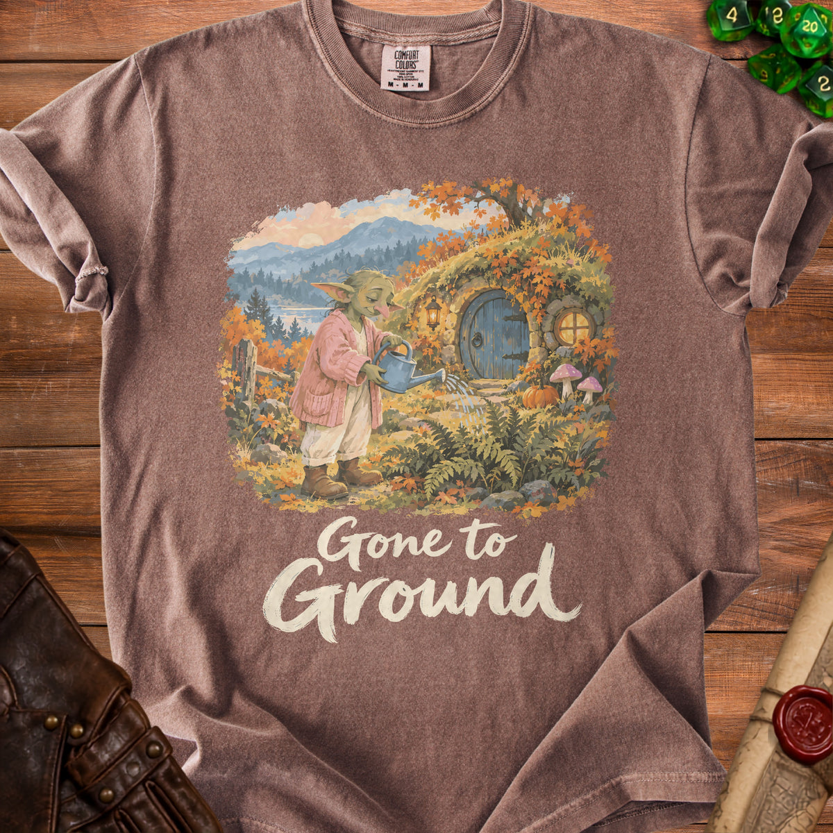 T-shirt with illustration of Yoda watering a hobbit hole, text "Gone to Ground".