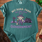 T-shirt with a distressed graphic of a goat holding a shovel and text "MY AURA FARM WAS SHUT DOWN BY THE GOVERNMENT".