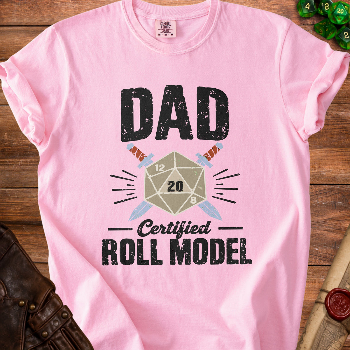 Pink t-shirt with "DAD Certified ROLL MODEL" text and a d20 dice design.