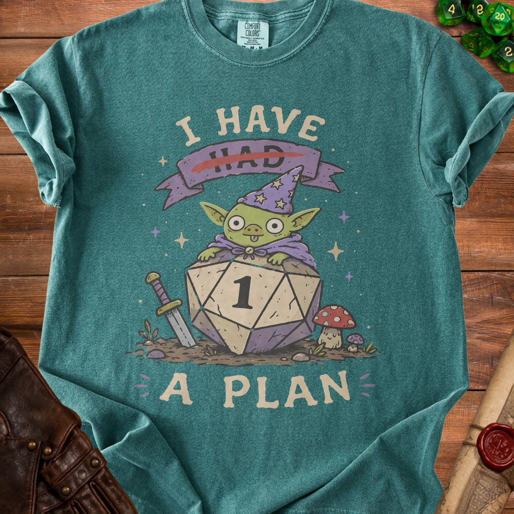 Green t-shirt with a wizard goblin sitting on a d20 die, reading "I HAD A PLAN".