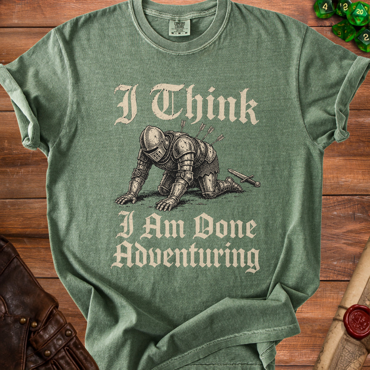 Green t-shirt with knight graphic and text "I Think I Am Done Adventuring".