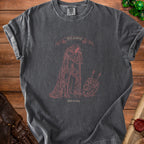 Dark grey t-shirt with "Still standing" and knight graphic that reads "Unfortunately".