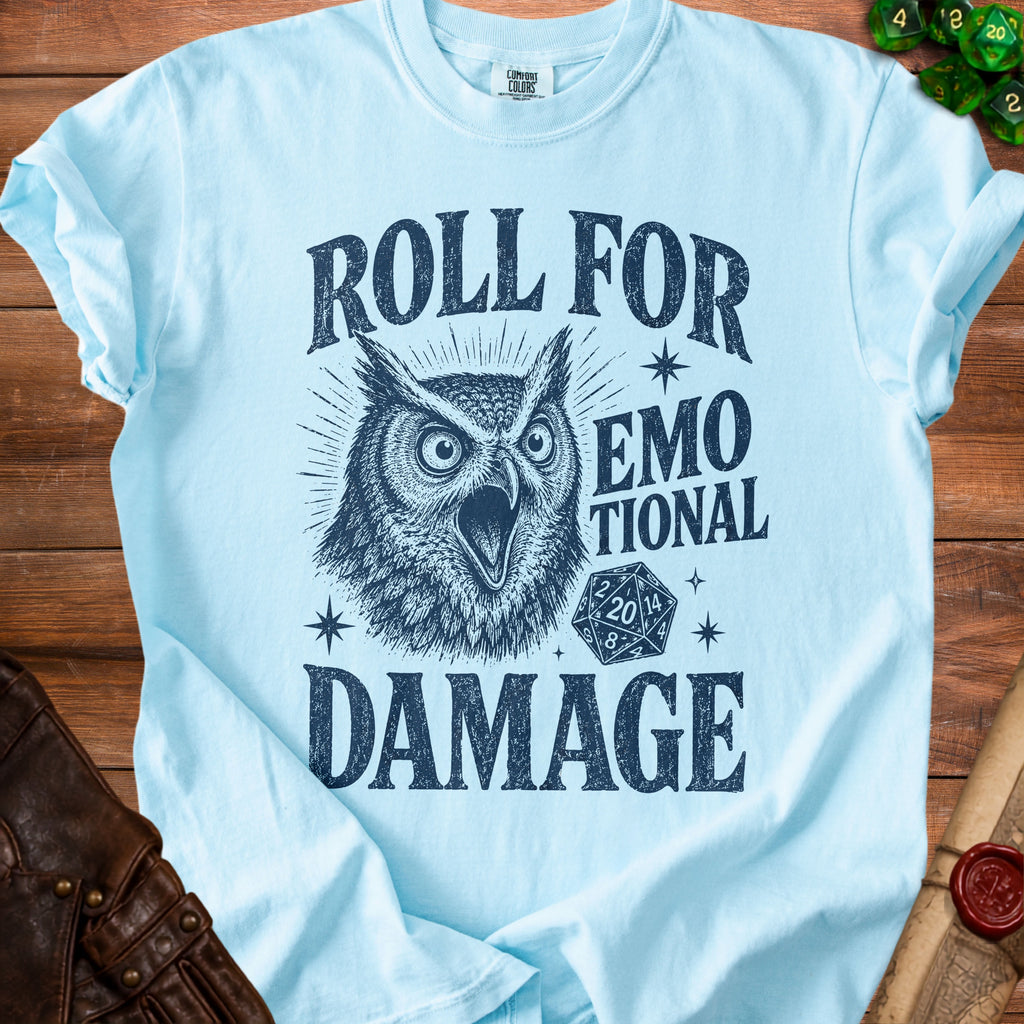 Light blue t-shirt with dark blue graphic of an owl, dice, and text reading "Roll for Emotional Damage".