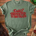 Green t-shirt with red text reading "Easily Distracted by Side Quests."