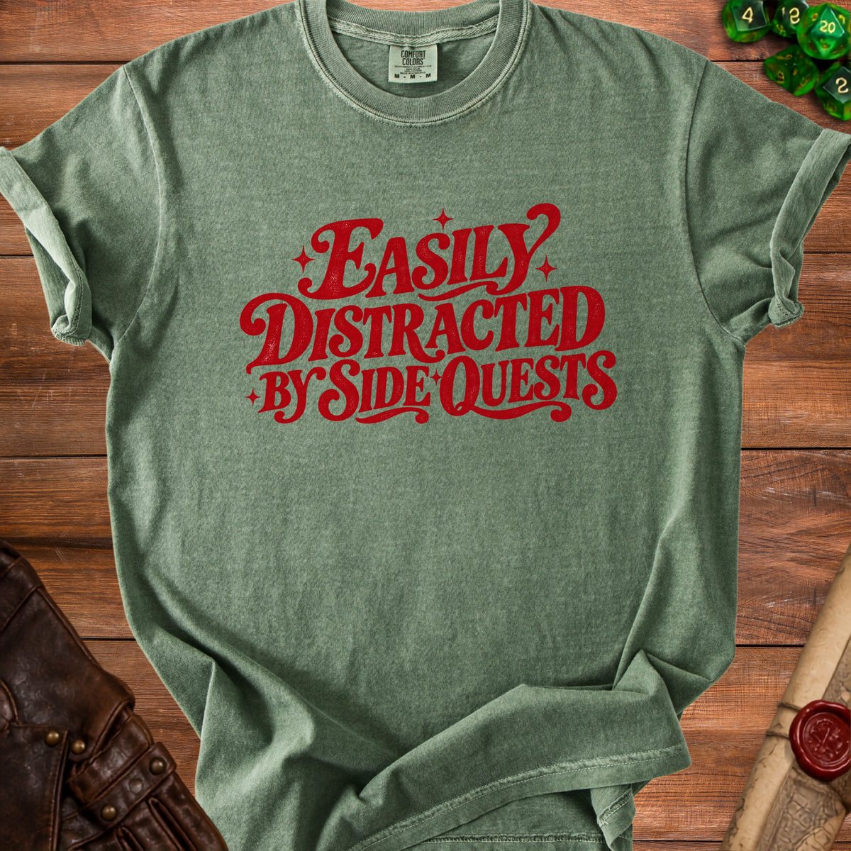 Green t-shirt with red text reading "Easily Distracted by Side Quests."