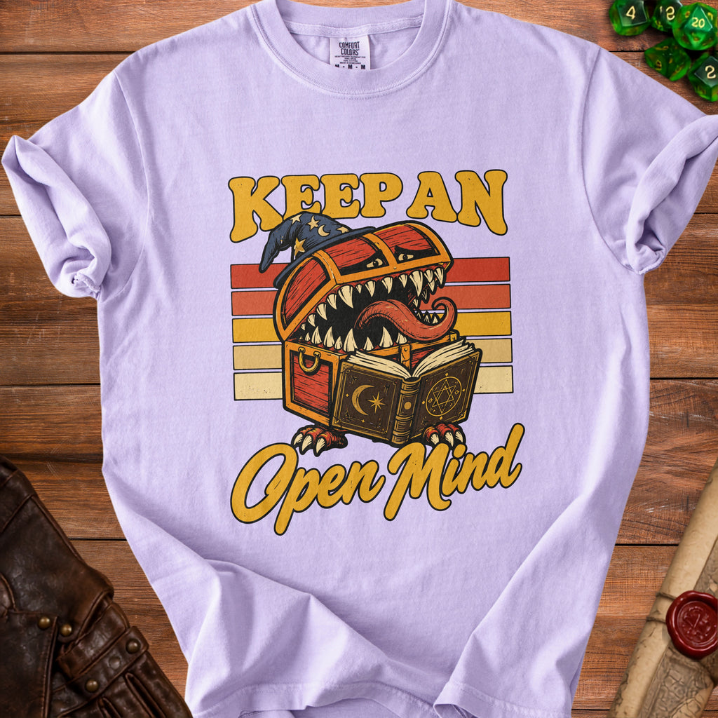 Light purple t-shirt with "Keep An Open Mind" and a monster chest graphic.