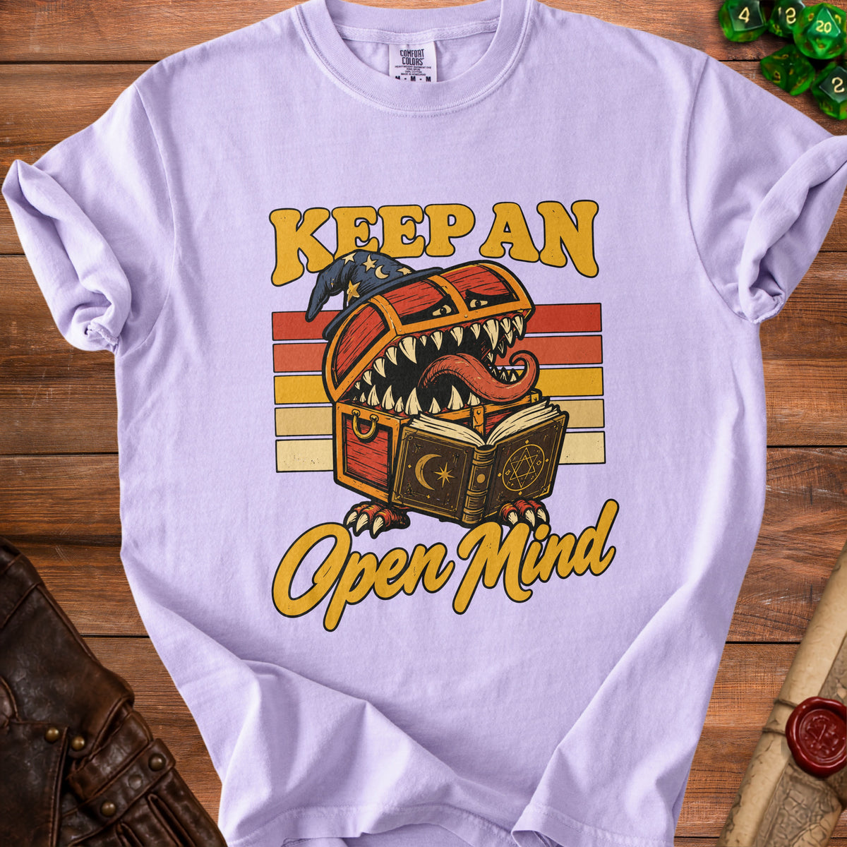 Light purple t-shirt with "Keep An Open Mind" and a monster chest graphic.